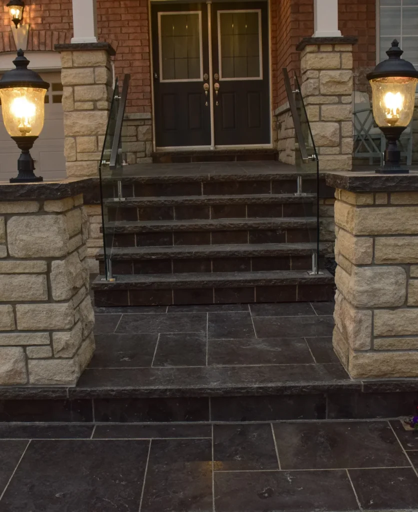 Pillars and walls and custom lighting installed by Mutti Landscaping for a customer's home in Ontario