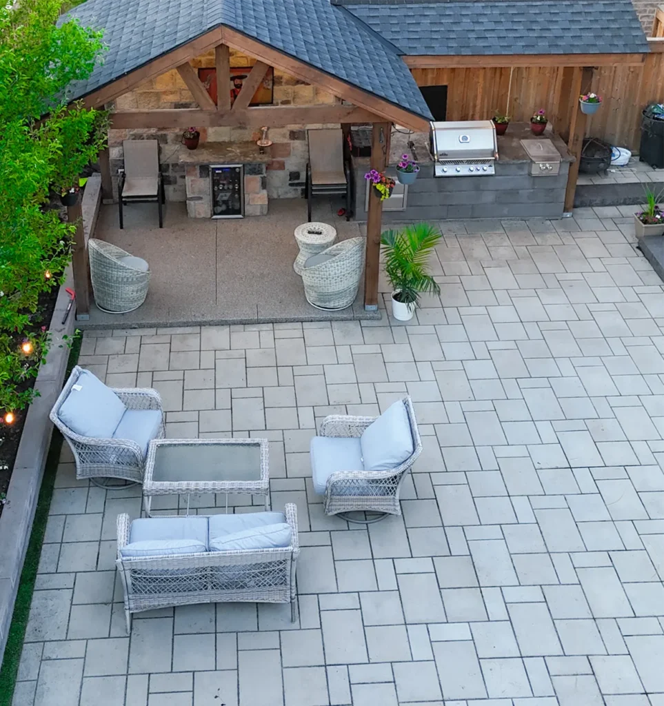 An outdoor kitchen / barbeque installed by Mutti Landcaping